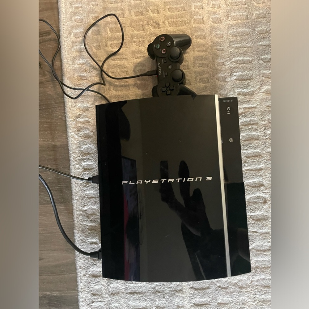 PlayStation 3 Console 160gb with 9 games. Black. One controller.